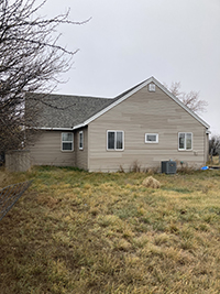 a house with trees in the background