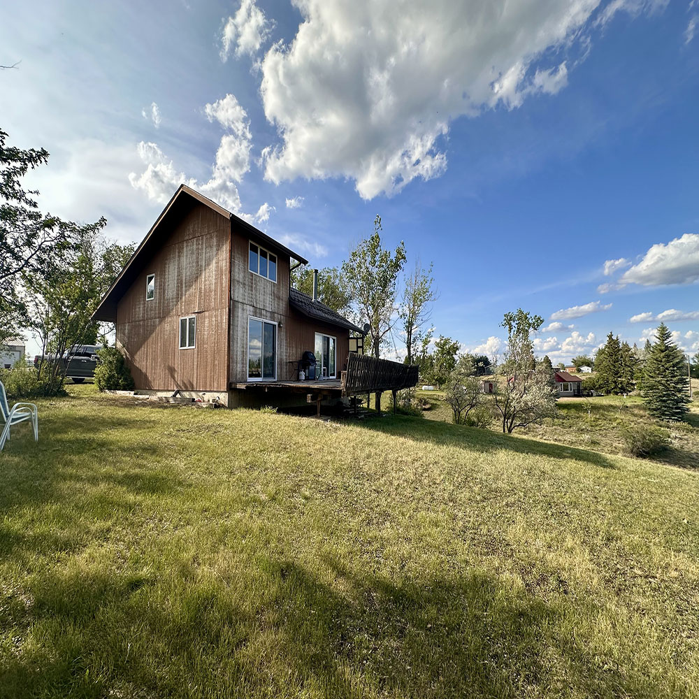 a house with trees in the background