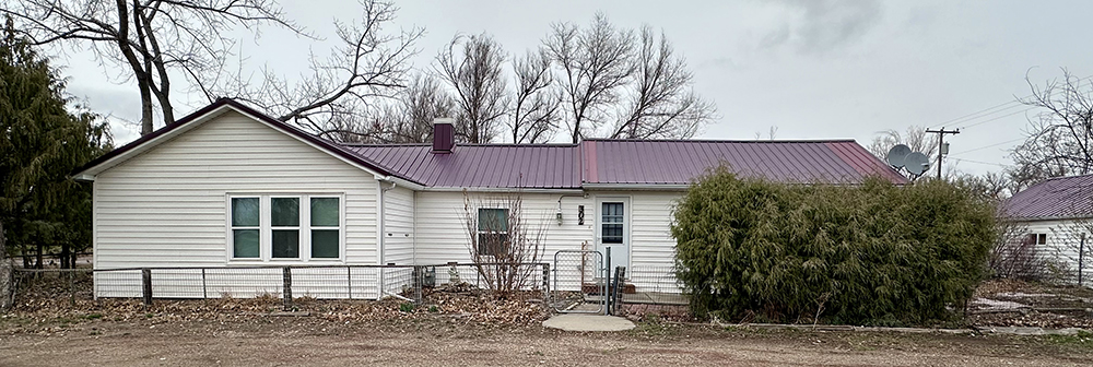 a house with trees in the background
