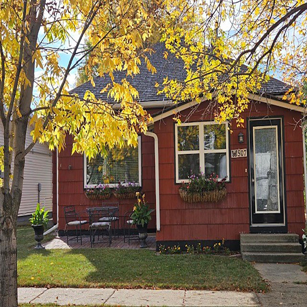 a house with trees in the background